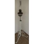 Late Victorian wrought metal adjustable height floor lamp with copper oil lamp