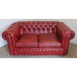 Small red chesterfield two seater sofa (153cm x 95cm)