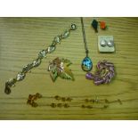 Collection of costume jewelry including brooches, necklaces, pendants, etc, some boxed