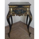 19th C gilt and lacquered papier-mache work table, the hinged rectangular top with traces of painted