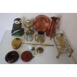 Cast metal doorstop in the form of an owl, brass trivets, a brass chestnut roaster, copper jug of