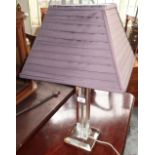 Contemporary table lamp with clear column and pleated grey shade