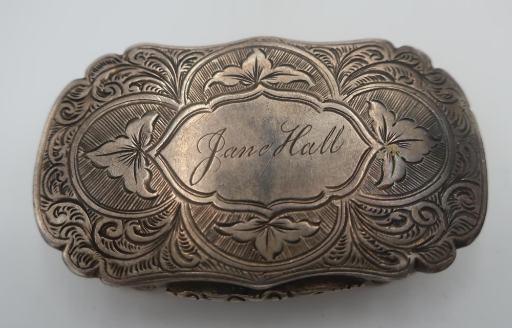 Victorian hallmarked silver shaped rectangular vinaigrette with floral engraved detail and name '