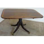 Regency mahogany rectangular breakfast table, satinwood banded tilt-top, on four sabre legs (127cm x