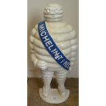 Large white cast Michelin Man door stop with blue sash (height 55cm)