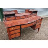 Edwardian satinwood serpentine front knee-hole dressing table with low raised back, on square
