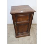 Edwardian pitch pine bedside cabinet with fielded panel door, on a plinth base (43cm x 25cm x 39cm)