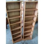 Pair of light oak finish narrow bookcases, with adjustable shelves (38cm x 137cm x 18cm)