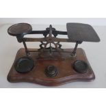 Set of vintage brass postage scales with assorted weights