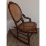 Late Victorian stained beech rocking chair with cane seat and back