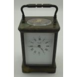 Large Angelus brass cased carriage clock with swing handle (13cm high)