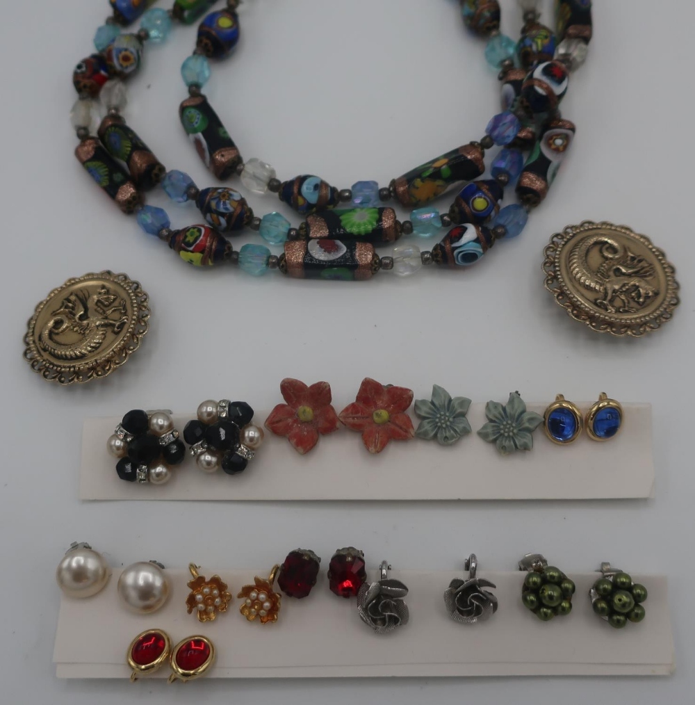 Collection of costume jewellery including assorted earrings, beads, silver coloured chains etc