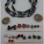 Collection of costume jewellery including assorted earrings, beads, silver coloured chains etc