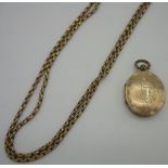 Edwardian gold plated muff chain (130cm) and a gold plated oval double photo. locket (2)