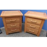 Pair of light wood three drawer bedside chests of three drawers (52cm x 62cm x 40cm)