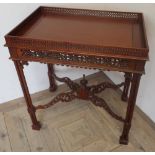 Chippendale style mahogany rectangular silver table, with fret work gallery and frieze on four