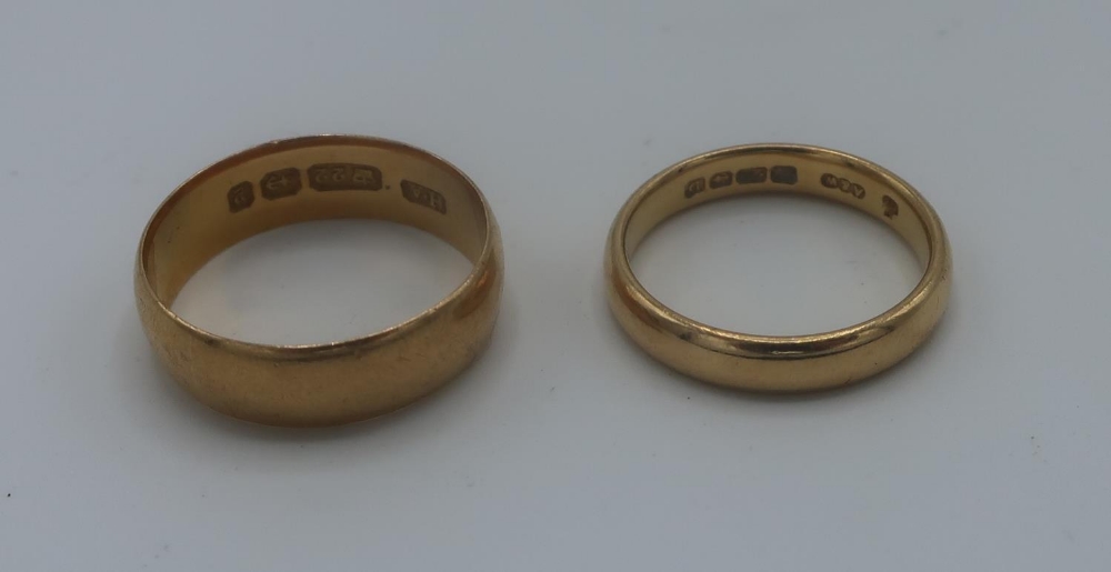 Two 22ct hallmarked gold wedding bands, 7.6g