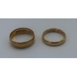 Two 22ct hallmarked gold wedding bands, 7.6g