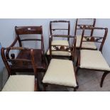 Set of five Regency mahogany dining chairs, with rope twist to rails, drop-in seats and sabre