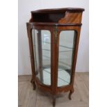 20th C french Kingwood serpentine display cabinet, with shelved top and gilt metal mounts, on