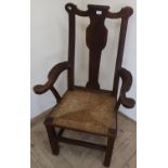18th/19th C Oak country style broad seated armchair with drop-in rush seat, on square supports