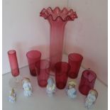 Ruby glass vase with frilled top and clear stem, four ruby glass tumblers, a jug with clear