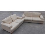 Large modern two seat sofa in oatmeal fabric and matching similar two seat sofa