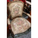 French style carved wood open armchair with gilt finish, tapestry seat and back on cabriole legs
