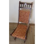Edwardian walnut and ebonised rocking chair
