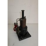 Vintage stationary live steam engine with burner