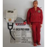 Six Million Dollar Man action figure, red suit with breast badge, with backpack radio and