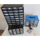 Four multi drawer cabinets containing watch parts, movements, and other items