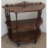 Victorian inlaid walnut whatnot three shaped tiers with fretwork rear supports and galleries , the