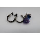 White metal eagle's claw and blue stone ball pendant, pair of earrings and an amethyst pendant