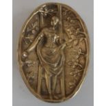 20th C brass oval dish, relief decorated with a study of a lady, the reverse with exposed buttocks