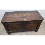 Small early 18th C oak coffer, with planked top, two paneled front and carved frieze (94cm x 48cm