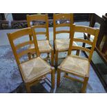 Set of four beech rush seated ladder back kitchen style chairs