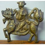 Embossed double sided hanging gilt metal Chinese decorative pendant in the form of a figure riding a