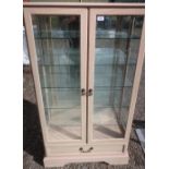 Morris Furniture Company light oak finish two door display cabinet with five glass shelves (82cm x