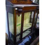 Art Nouveau mahogany inlaid cabinet, enclosed by single glazed door, flagged by two lead glazed