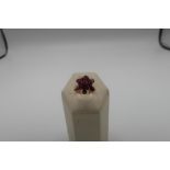 Burmese multi stone ruby flowerhead ring with unmarked yellow metal mounts (tested 22 - 24ct)