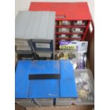 Three watch makers storage drawers containing parts including batteries, balances, stems, etc