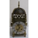 Late 19th C lantern clock with silver chapter ring and engraved decoration (converted to quartz