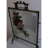 Early 20th C brass framed firescreen with inset bevel edged mirror panel with hand painted