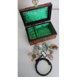 Small Chinese brass bound hardwood jewellery box containing a small quantity of polished stones,