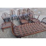 Collection of Ercol dark furniture: four dining chairs with fleur de lys splat, small coffee