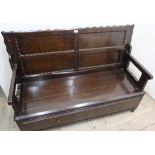 Oak monks bench, with four paneled top above a single long drawer (130cm x 87cm x 50cm)
