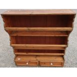 Victorian waxed pine wall rack with three shelves and two drawers (95cm x 26cm x 102cm)