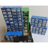 Six storage drawers containing various watch parts