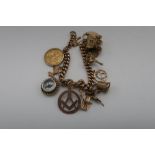9ct gold charm bracelet with heart shaped padlock clasp and 11 charms including 1907 Edward 7th full